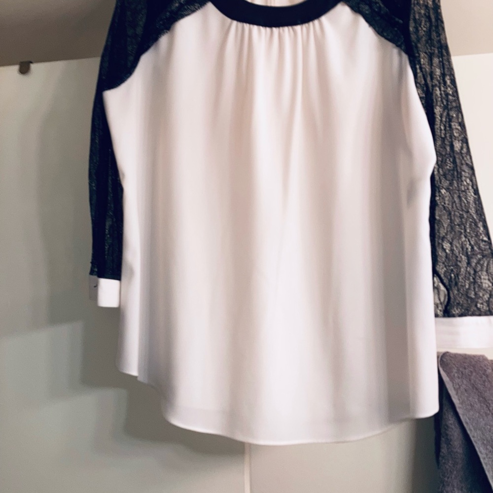 White/black sequin sleeves, faux leather collar.